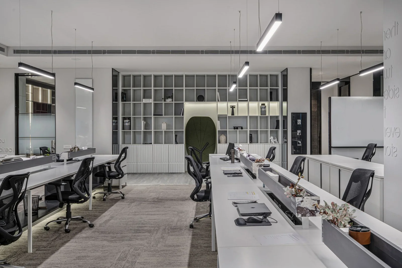 An open office with desks and meeting areas